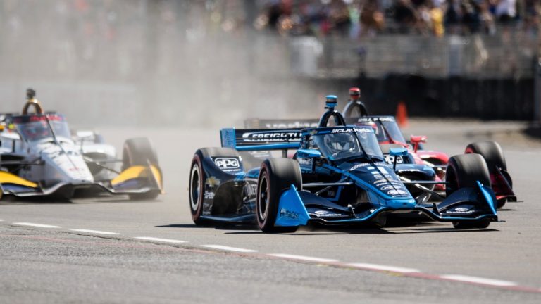 Scott McLaughlin, front, competes at the Grand Prix of Portland IndyCar auto race at the Portland International Raceway in Portland, Ore., on Sunday, Sept. 4, 2022. (Naji Saker/The Oregonian via AP)