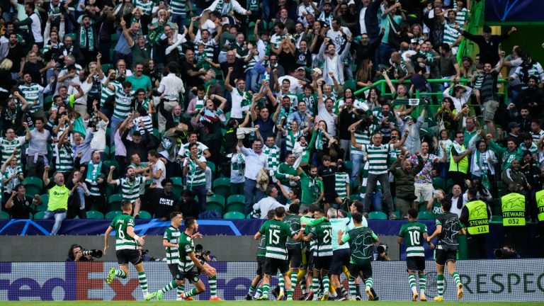 Sporting's players celebrate their side second goal against Tottenham during a Champions League group D soccer match between Sporting CP and Tottenham Hotspur at the Alvalade stadium. (Armando Franca/AP)
