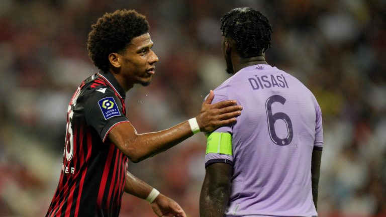 Monaco's Axel Disasi, right, and Nice's Jean-Clair Todibo talk during the League One soccer match between Nice and Monaco at the Allianz Riviera stadium in Nice, Sunday, Sept. 4, 2022. (Daniel Cole/AP)