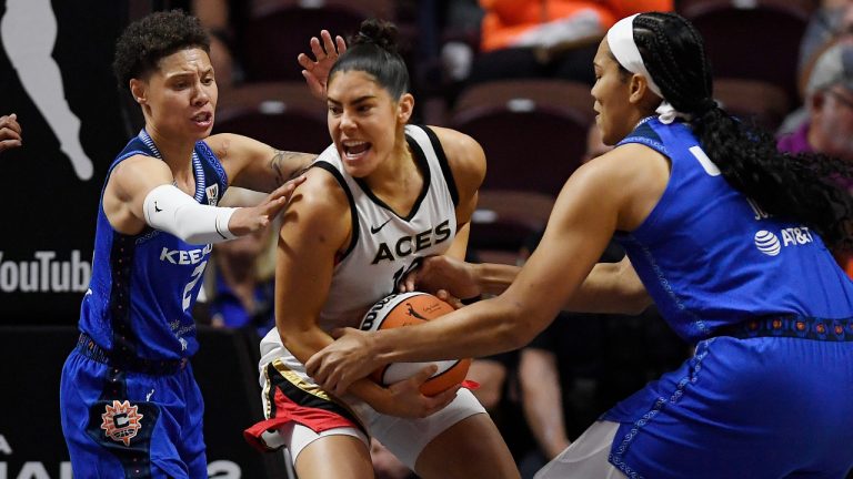Connecticut Sun's Natisha Hiedeman, left, and Brionna Jones, right, pressure Las Vegas Aces' Kelsey Plum during the first half in Game 3 of basketball's WNBA Finals on Thursday, Sept. 15, 2022, in Uncasville, Conn. (Jessica Hill/AP)