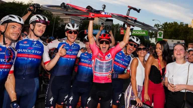 Belgian Remco Evenepoel of Quick-Step Alpha Vinyl, center, celebrates with teammates after winning the Vuelta cycling race, in Madrid, Spain, Sunday, Sept. 11, 2022. (Manu Fernandez/AP)