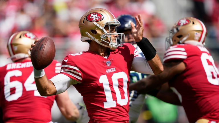 San Francisco 49ers quarterback Jimmy Garoppolo (10) passes against the Seattle Seahawks during the first half of an NFL football game in Santa Clara, Calif., Sunday, Sept. 18, 2022. (Tony Avelar/AP)
