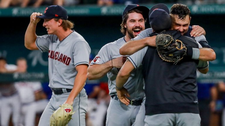 Cleveland Guardians players celebrate winning the American League Central after defeating the Texas Rangers in a baseball game in Arlington, Texas, Sunday, Sept. 25, 2022. (Gareth Patterson/AP)