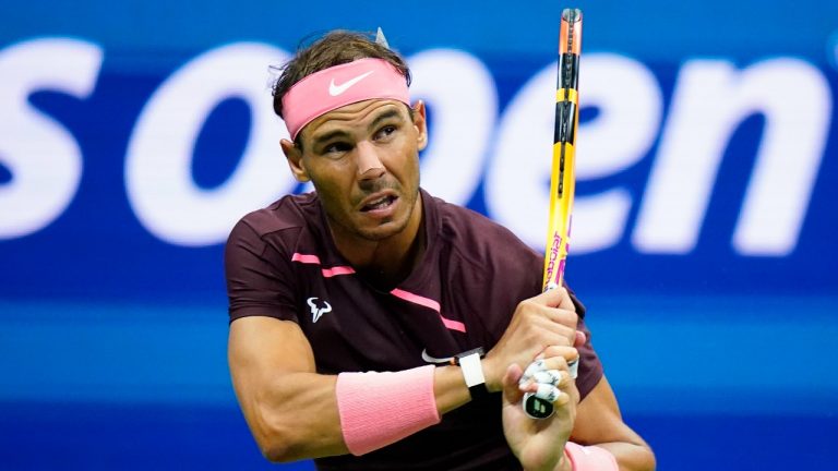 Rafael Nadal, of Spain, wearing a bandage on his nose, returns a shot to Fabio Fognini, of Italy, during the second round of the U.S. Open tennis championships, Friday, Sept. 2, 2022, in New York. (Frank Franklin II/AP)