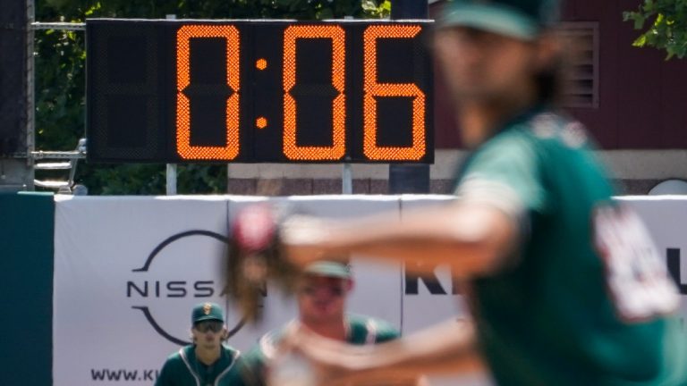A pitch clock is deployed to restrict pitcher preparation times during a minor league baseball game between the Brooklyn Cyclones and Greensboro Grasshoppers, Wednesday, July 13, 2022, in the Coney Island neighborhood of the Brooklyn borough of New York. Major League Baseball is considering a pitch clock for next year along with shift limits, larger bases and restrictions on pickoff attempts. (John Minchillo/AP)