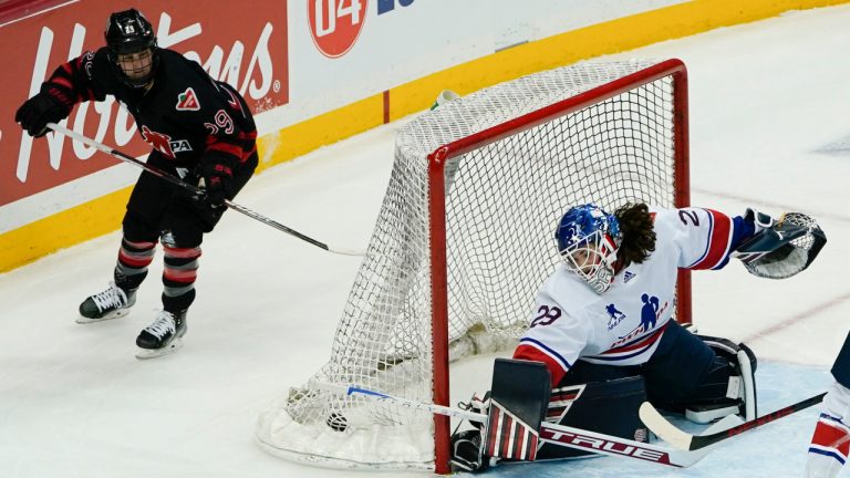 The puck is in the net after Canada's Marie-Philip Poulin (29) scored on United States' goalie Nicole Hensley (29) during the overtime period of a women's exhibition hockey game billed as the "Rivalry Rematch", Saturday, March 12, 2022, in Pittsburgh. (Keith Srakocic/AP) 