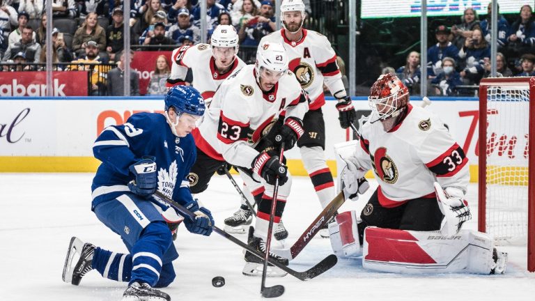 Toronto Maple Leafs centre Pontus Holmberg (29) tries to score on Ottawa Senators goaltender Cam Talbot (33) while defenceman Travis Hamonic (23), left wing Austin Watson (16) and defenceman Jake Sanderson (85) defend, during second period NHL pre-season action in Toronto on Saturday, September 24, 2022. (Christopher Katsarov/CP)