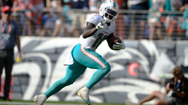 Miami-Dolphins-wide-receiver-Tyreek-Hill-gestures-as-he-runs-for-a-touchdown-against-the-Baltimore-Ravens