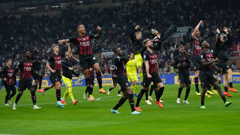 AC Milan's players celebrate at the end of the Serie A soccer match between AC Milan and Juventus at the San Siro stadium, in Milan, Italy, Saturday, Oct. 8, 2022. (Antonio Calanni/AP)