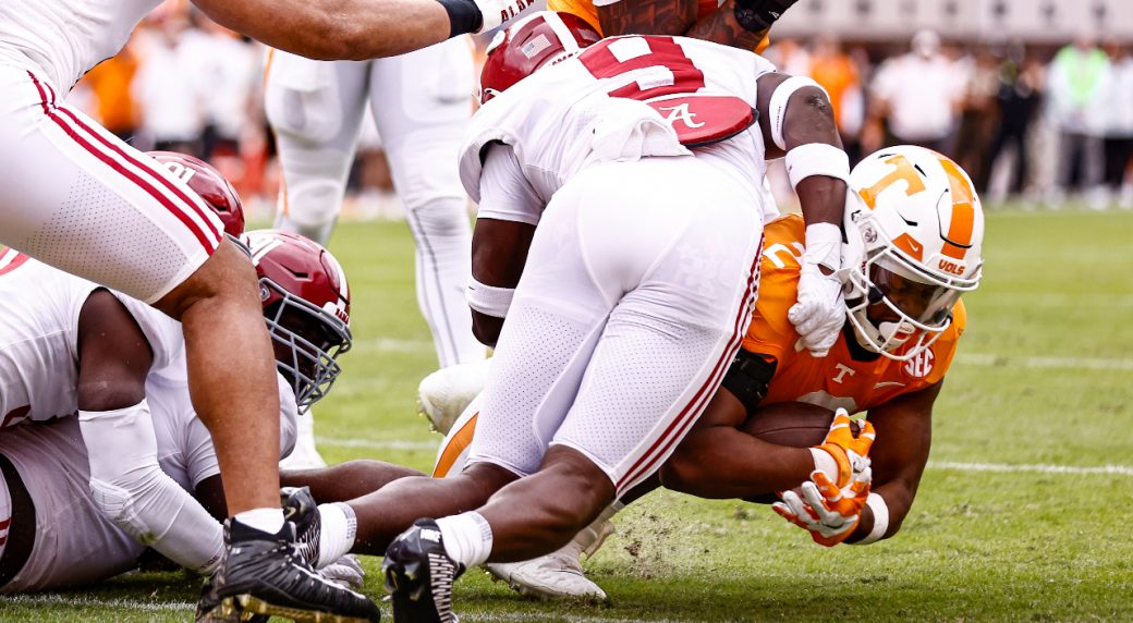 100,000 fans storm field, carry off goalposts after Tennessee shocks
