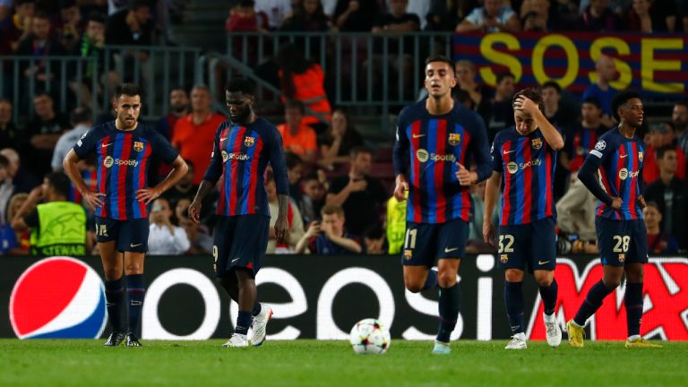 Barcelona players react after Bayern's Benjamin Pavard scores his side's third goal during the Champions League Group C soccer match between Barcelona and Bayern Munich at the Camp Nou stadium in Barcelona, Spain, Wednesday, Oct. 26, 2022. (AP Photo/Joan Monfort)