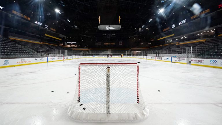 Members of the Arizona State University hockey team skate on the ice at the new Mullett Arena, Monday, Oct. 24, 2022, in Tempe, Ariz. The university will be sharing the arena with the Arizona Coyotes NHL hockey team. (AP Photo/Ross D. Franklin)