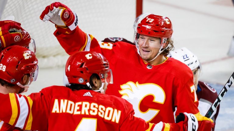 Calgary Flames forward Tyler Toffoli, right, celebrates a goal with teammate defenceman Rasmus Andersson during third period NHL hockey action against the Colorado Avalanche in Calgary, Thursday, Oct. 13, 2022. (Jeff McIntosh/CP)