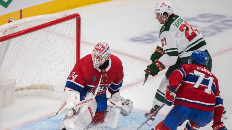 Minnesota Wild’s Brandon Duhaime (21) scores on Montreal Canadiens goaltender Jake Allen as Canadiens’ Jake Evans defends during second period NHL hockey action in Montreal, Tuesday, October 25, 2022.(Graham Hughes/CP)