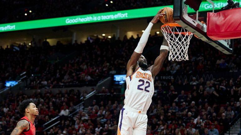 Phoenix Suns center Deandre Ayton, right, dunks in front of Portland Trail Blazers guard Anfernee Simons during the second half of an NBA basketball game in Portland, Ore., Friday, Oct. 21, 2022. (Craig Mitchelldyer/AP)