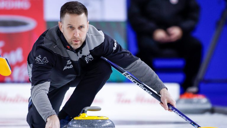 Team Wild Card One skip Brad Gushue makes a shot while playing Team Saskatchewan during semi-final action at the Tim Hortons Brier in Lethbridge, Alta., Saturday, March 12, 2022. (Jeff McIntosh/CP)