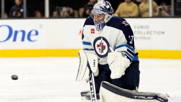 Winnipeg Jets goaltender Connor Hellebuyck (37) prepares to make a save during the second period in an NHL hockey game against the Vegas Golden Knights, Sunday, Oct. 30, 2022, in Las Vegas. (Ellen Schmidt/AP)