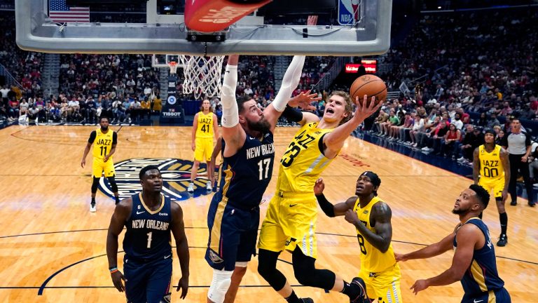 Utah Jazz forward Lauri Markkanen (23) goes to the basket against New Orleans Pelicans center Jonas Valanciunas (17) in the first half of an NBA basketball game in New Orleans, Sunday, Oct. 23, 2022. (Gerald Herbert/AP)