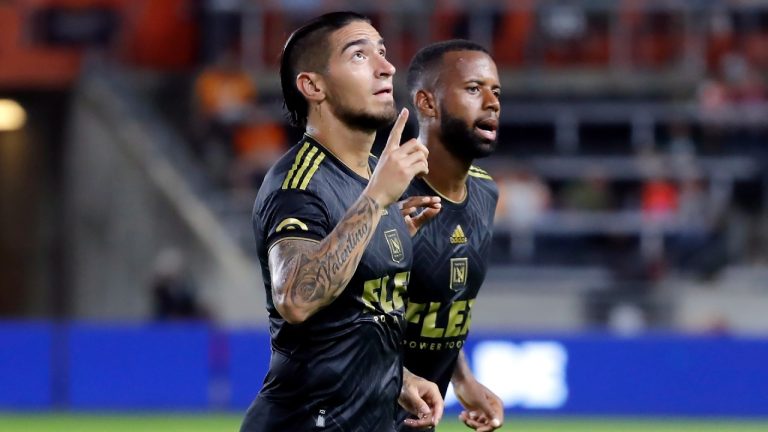 Los Angeles FC forward Cristian Arango, left, points up next to midfielder Kellyn Acosta, right, after Arango's goal against the Houston Dynamo during the first half of an MLS soccer match Wednesday, Aug. 31, 2022, in Houston. (Michael Wyke/AP)
