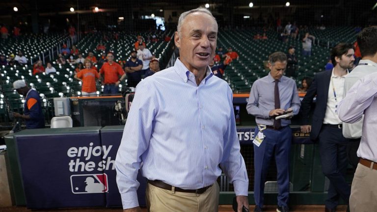 Major League Baseball Commissioner Rob Manfred walks on the field before Game 2 of an American League Division Series baseball game between the Houston Astros and the Seattle Mariners in Houston, Thursday, Oct. 13, 2022. (David J. Phillip/AP)