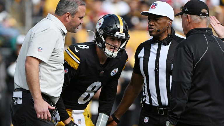 Pittsburgh Steelers quarterback Kenny Pickett (8) is helped on the field after being injured during the second half of an NFL football game against the Tampa Bay Buccaneers in Pittsburgh, Sunday, Oct. 16, 2022. (Barry Reeger/AP)