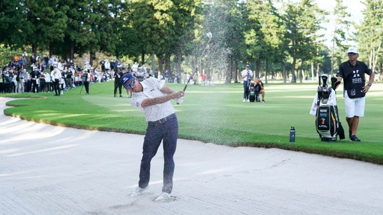 Rickie Fowler of the United States hits out from a bunker on the eighteenth hole during the third round of the Zozo Championship golf tournament at Accordia Golf Narashino Country Club on Saturday, Oct. 15, 2022, in Inzai, Chiba prefecture, east of Tokyo, Japan. (Tomohiro Ohsumi/AP)