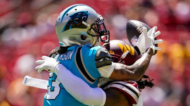 Carolina Panthers wide receiver Robbie Anderson, left, can't catch a pass as Washington Commanders safety Bobby McCain defends during the first half of a NFL preseason football game Saturday, Aug. 13, 2022, in Landover, Md. (Alex Brandon/AP)