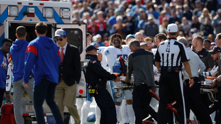 Detroit Lions cornerback Saivion Smith, lying on stretcher, is loaded into an ambulance during the first half of an NFL football game against the New England Patriots. (Michael Dwyer/AP)