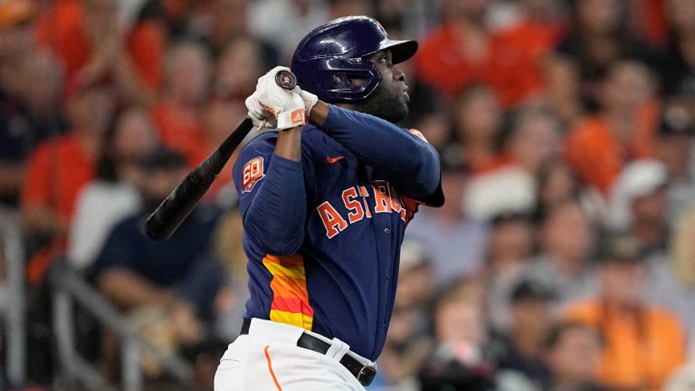 Houston Astros designated hitter Yordan Alvarez watches his two-run home run against the Seattle Mariners during the sixth inning in Game 2 of an American League Division Series baseball game in Houston, Thursday, Oct. 13, 2022. (David J. Phillip/AP)
