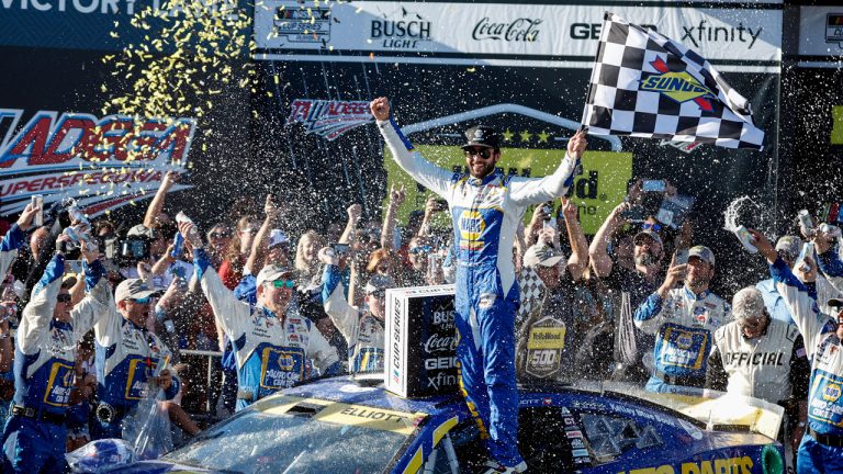 Chase Elliott celebrates in Victory Lane after winning a NASCAR Cup Series auto race. (Butch Dill/AP)