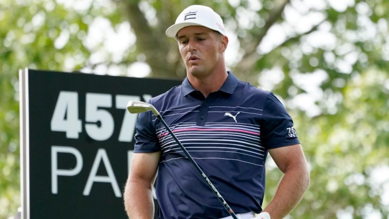 Bryson DeChambeau looks at his club after hitting his tee shot on the fourth hole during the final round of the LIV Golf Invitational-Chicago tournament Sunday, Sept. 18, 2022, in Sugar Hill, Ill. (Charles Rex Arbogast/AP) 