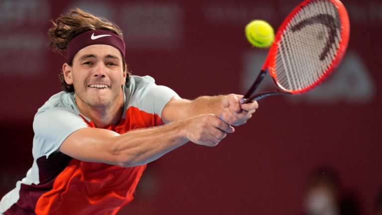 Taylor Fritz of the U.S. returns a shot against Denis Shapovalov of Canada during their semifinal match in the Japan Open tennis championships in Tokyo, Saturday, Oct. 8, 2022. (Hiro Komae/AP)