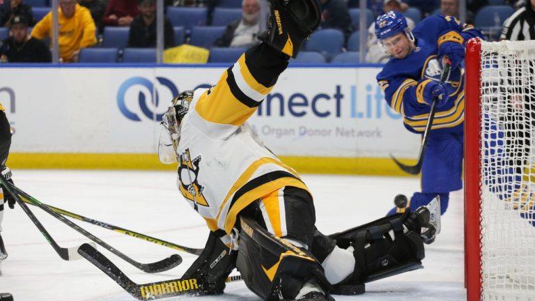 Pittsburgh Penguins goaltender Tristan Jarry (35) blocks a shot by Buffalo Sabres right wing Jack Quinn (22) during the second period of a preseason NHL hockey game Saturday, Oct. 1, 2022, in Buffalo, N.Y. (Joshua Bessex/AP)