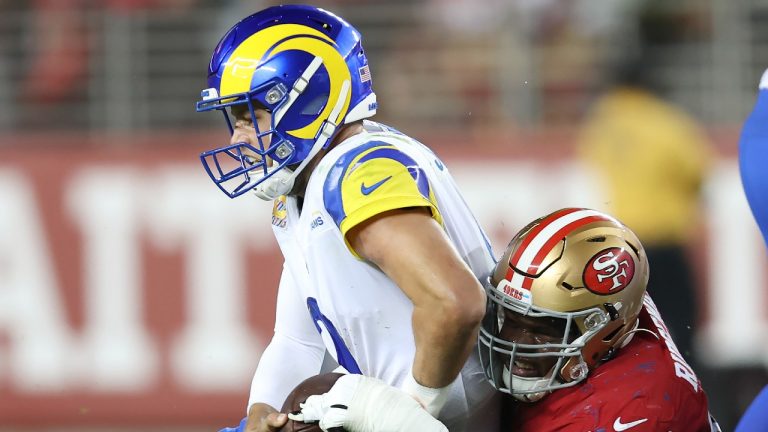 Los Angeles Rams quarterback Matthew Stafford, left, is sacked by San Francisco 49ers defensive tackle Hassan Ridgeway during the second half of an NFL football game in Santa Clara, Calif., Monday, Oct. 3, 2022. (Photo/AP)