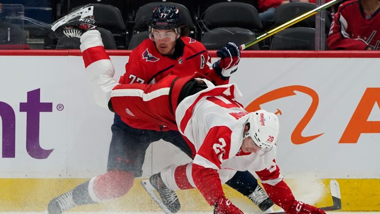 Washington Capitals right wing T.J. Oshie and Detroit Red Wings defenseman Albert Johansson collide in the second period of a preseason NHL hockey game, Wednesday, Oct. 5, 2022, in Washington. (Alex Brandon/AP)