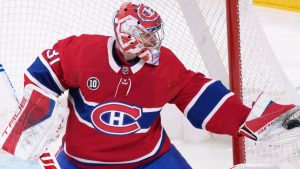 Montreal Canadiens goaltender Carey Price gloves the puck during first period NHL hockey action against the Florida Panthers, in Montreal on Friday, April 29, 2022. THE CANADIAN PRESS/Paul Chiasson