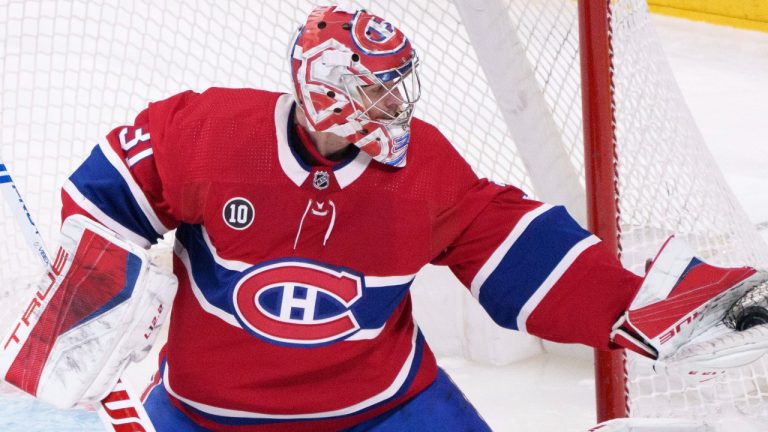 Montreal Canadiens goaltender Carey Price gloves the puck during first period NHL hockey action against the Florida Panthers, in Montreal on Friday, April 29, 2022. THE CANADIAN PRESS/Paul Chiasson