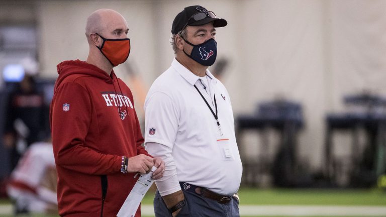 Houston Texans executive vice president, football operations Jack Easterby, left, stands with Texans chairman and CEO Cal McNair as they watch workouts during an NFL training camp. (Brett Coomer/AP)
