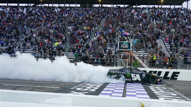 Ty Gibbs performs a burnout after winning a NASCAR Xfinity series auto race at Martinsville Speedway, Saturday, Oct. 29, 2022, in Martinsville, Va. (Chuck Burton/AP)