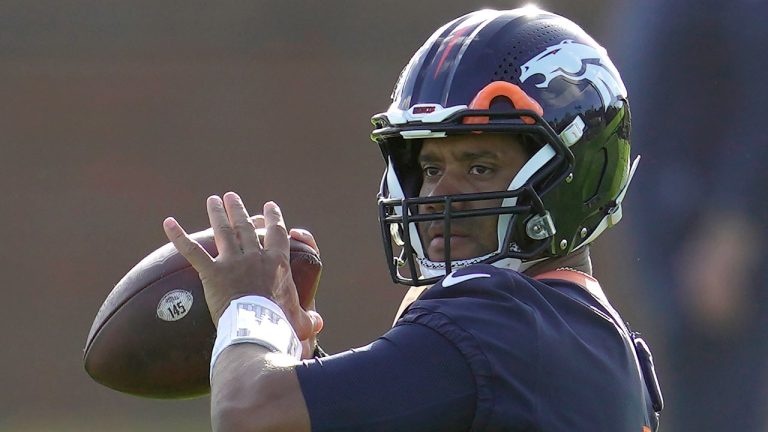 Denver Broncos quarterback Russell Wilson throws the ball during a practice session in Harrow, England, Wednesday, Oct. 26, 2022 (Kin Cheung/AP)