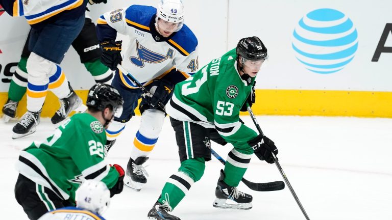 Dallas Stars center Wyatt Johnston (53) controls the puck on an attack as St. Louis Blues' William Bitten (42), Ivan Barbashev (49) and Matej Blumel (22) follow behind in the second period of a preseason NHL hockey game in Dallas, Monday, Sept. 26, 2022. (Tony Gutierrez/AP Photo)