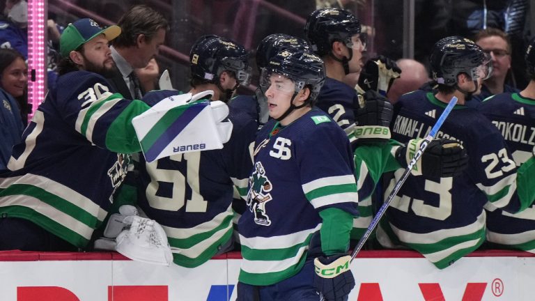 Vancouver Canucks' Andrei Kuzmenko, of Russia, celebraters his goal against the Vegas Golden Knights during second period NHL hockey action in Vancouver, B.C., Monday, Nov. 21, 2022. (Darryl Dyck/CP)