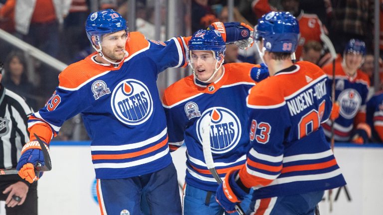 Edmonton Oilers' Leon Draisaitl (29), Tyson Barrie (22) and Ryan Nugent-Hopkins (93) celebrate a goal against the New Jersey Devils during second period NHL action in Edmonton on Thursday, November 3, 2022. (Jason Franson/CP)