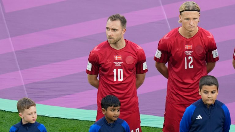 Denmark's Christian Eriksen, centre, and Kasper Dolberg line up prior the World Cup group D soccer match between Denmark and Tunisia at the Education City Stadium in Al Rayyan, Qatar, Tuesday, Nov. 22, 2022. (Darko Bandic/AP)