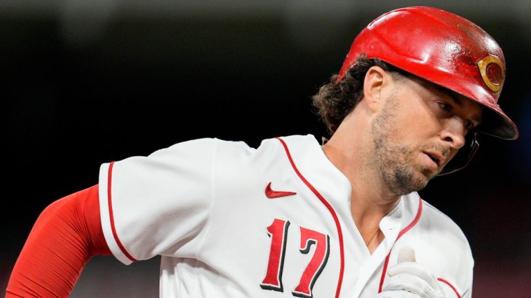 Cincinnati Reds' Kyle Farmer rounds third base after hitting a solo home run against the Milwaukee Brewers during the sixth inning of a baseball game Thursday, Sept. 22, 2022, in Cincinnati. (Jeff Dean/AP)