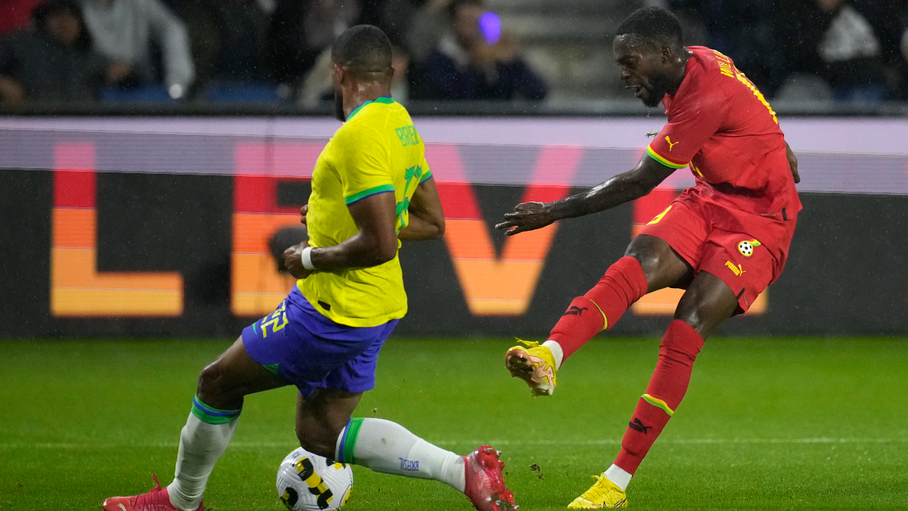 Ghana's Inaki Williams, right, attempts a shot at goal in front of Brazil's Gleison Bremer during the international friendly soccer match between Brazil and Ghana in Le Havre, western France, Friday, Sept. 23, 2022. (Christophe Ena/AP)
