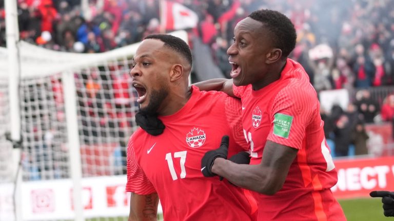 Canada's Cyle Larin (17) celebrates his goal with Richie Laryea against Jamaica during first half CONCACAF World Cup soccer qualifying action in Toronto on Sunday, March 27, 2022. Can Larin be the first to score a goal for Canada at the World Cup? (Nathan Denette/The Canadian Press)