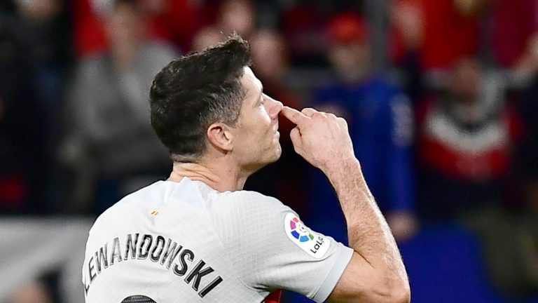 Barcelona's Robert Lewandowski reacts during a Spanish La Liga soccer match between Osasuna and Barcelona at El Sadar stadium in Pamplona, Spain, Tuesday, Nov. 8, 2022. (Alvaro Barrientos/AP)