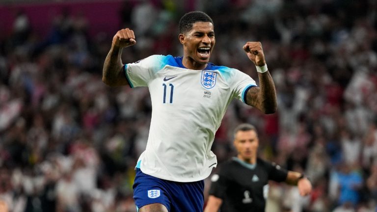England's Marcus Rashford celebrates after scoring his side's third goal during the World Cup group B soccer match between England and Wales, at the Ahmad Bin Ali Stadium in Al Rayyan , Qatar, Tuesday, Nov. 29, 2022. (Frank Augstein/AP)