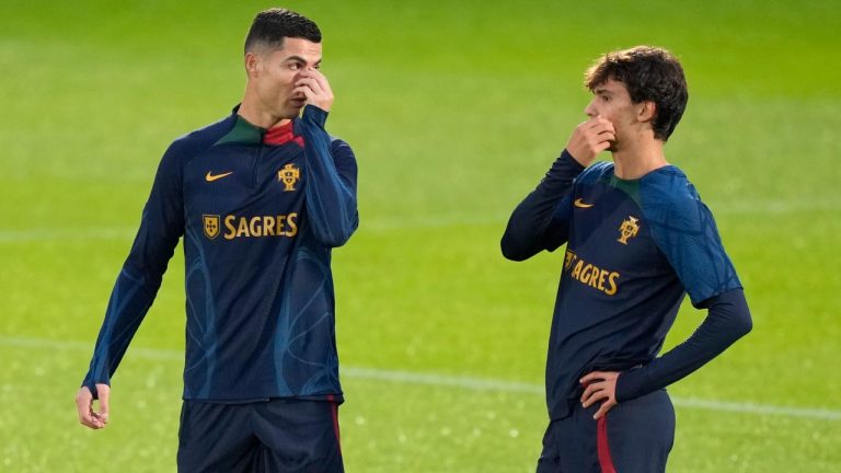Cristiano Ronaldo talks with teammate Joao Felix, right, during a Portugal training in Oeiras, outside Lisbon, Monday, Nov. 14, 2022. The young talent in Portugal's squad could be the deciding factor in whether or not Ronaldo gets to lift the elusive World Cup trophy (Armando Franca/AP Photo)